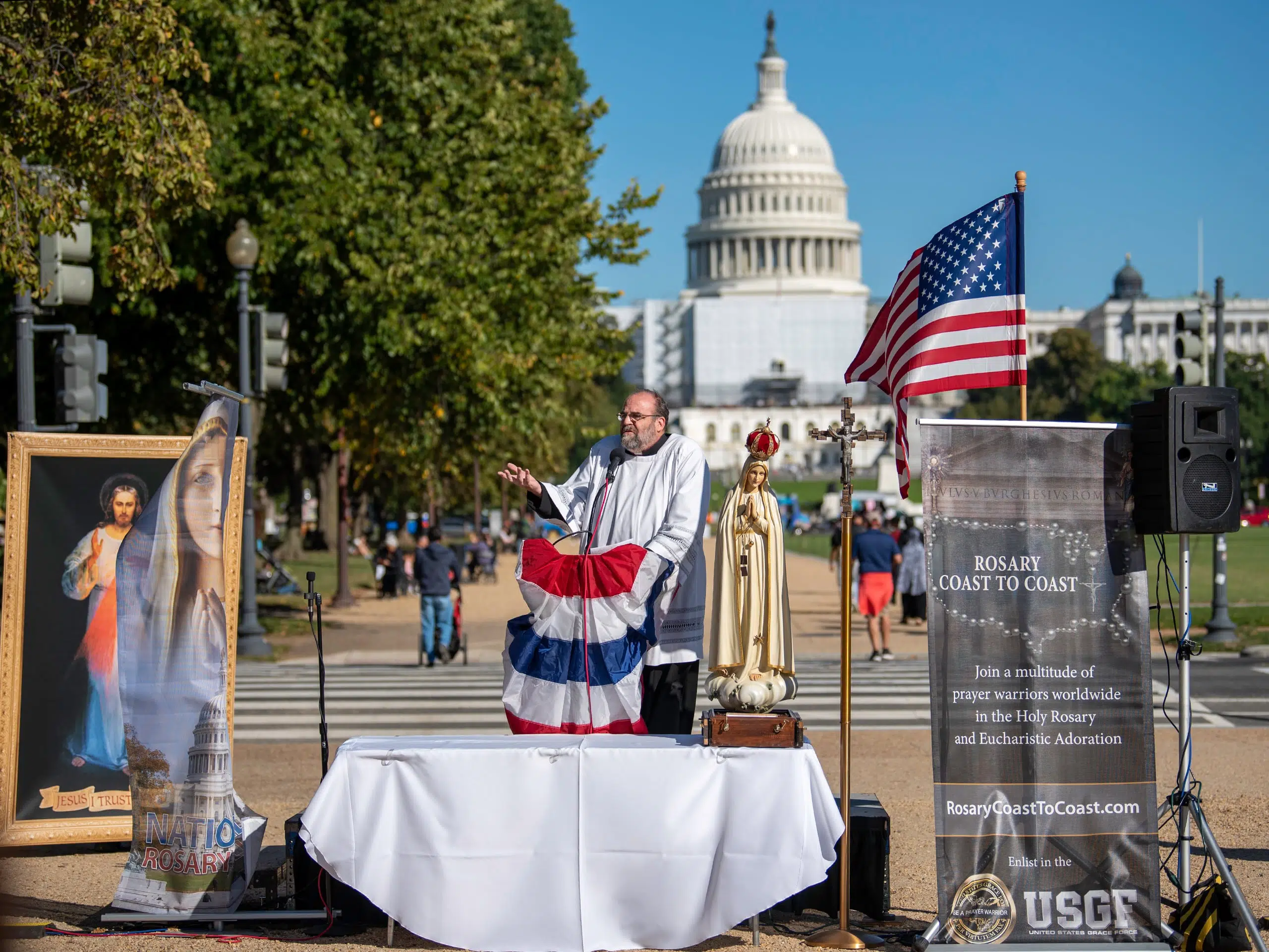 Rally participants gather near U.S. Capitol to pray rosary for the